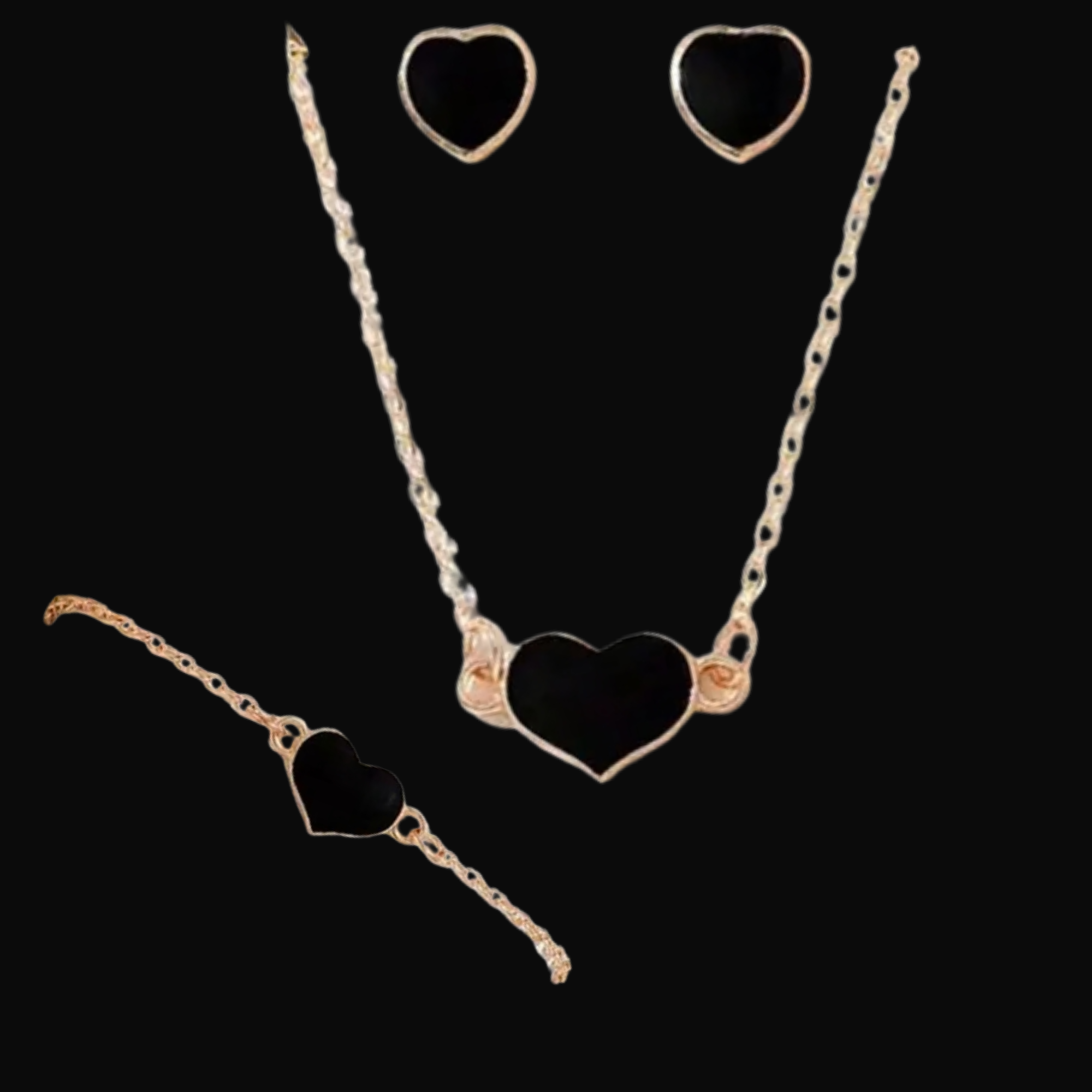 Gold necklace with heart design on a black background