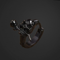 Black skull earring on a dark background