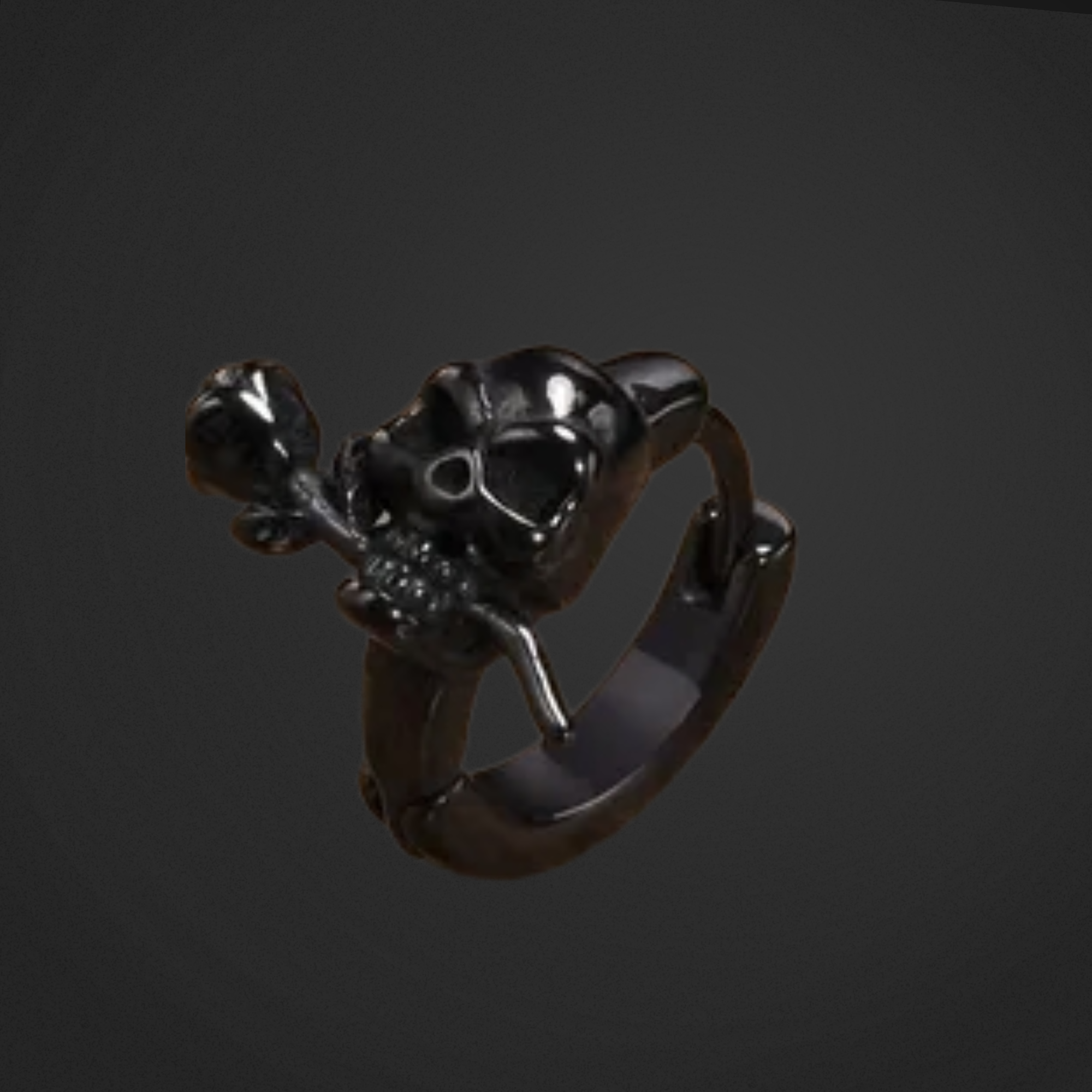 Black skull earring on a dark background