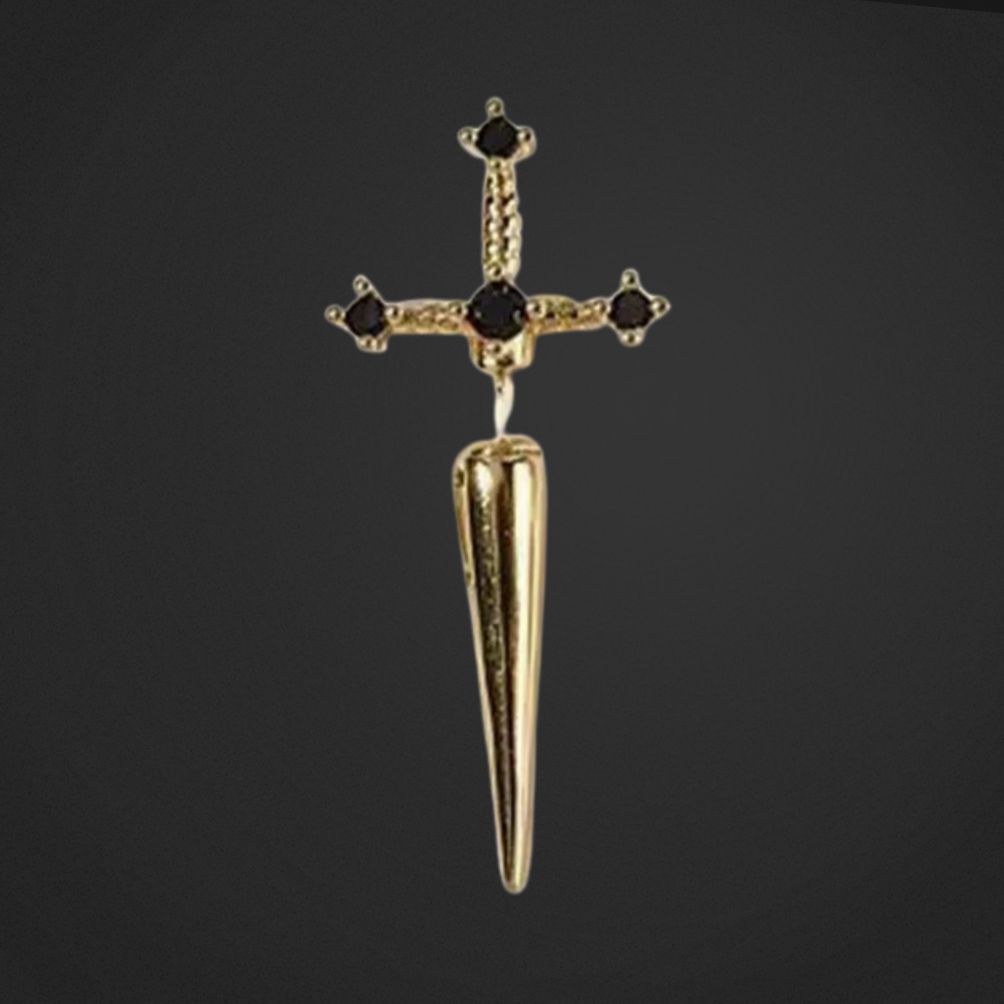 Gold dagger-shaped pendant with cross design on a black background