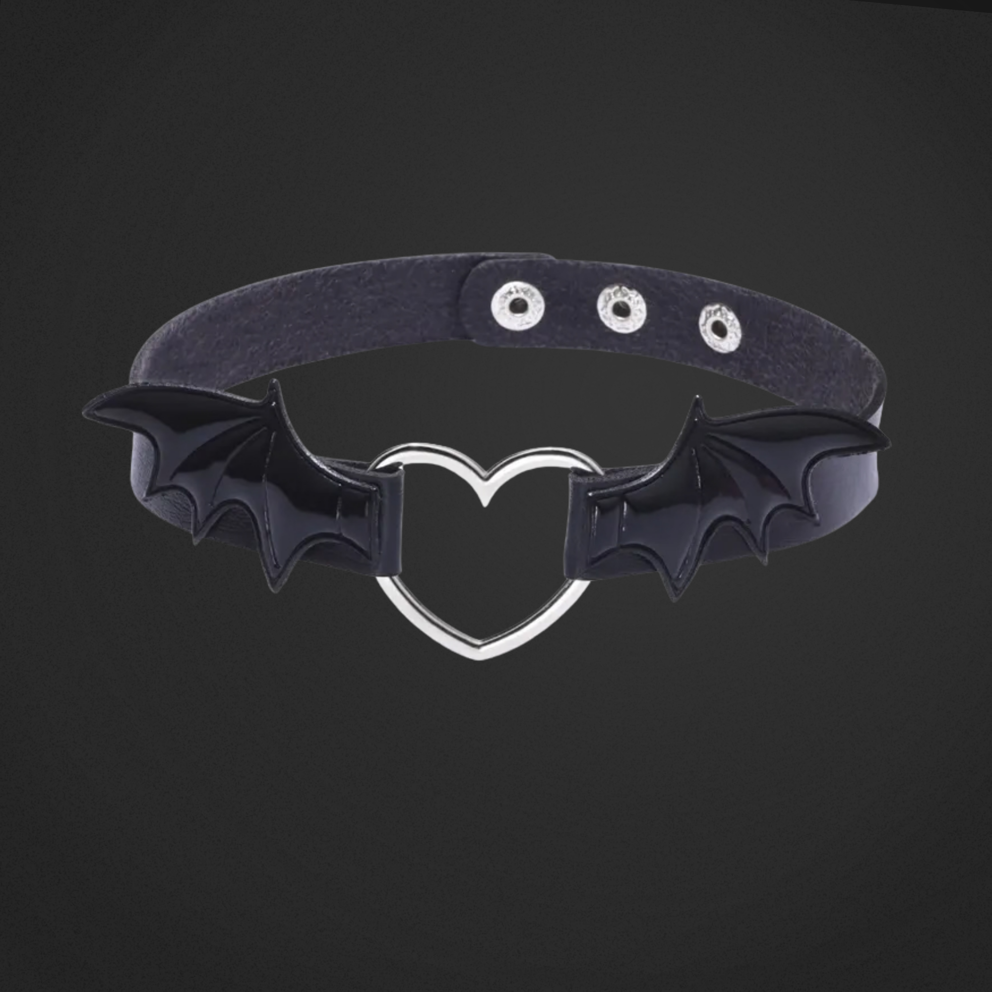 Black choker with bat wings and a heart-shaped center on a black background