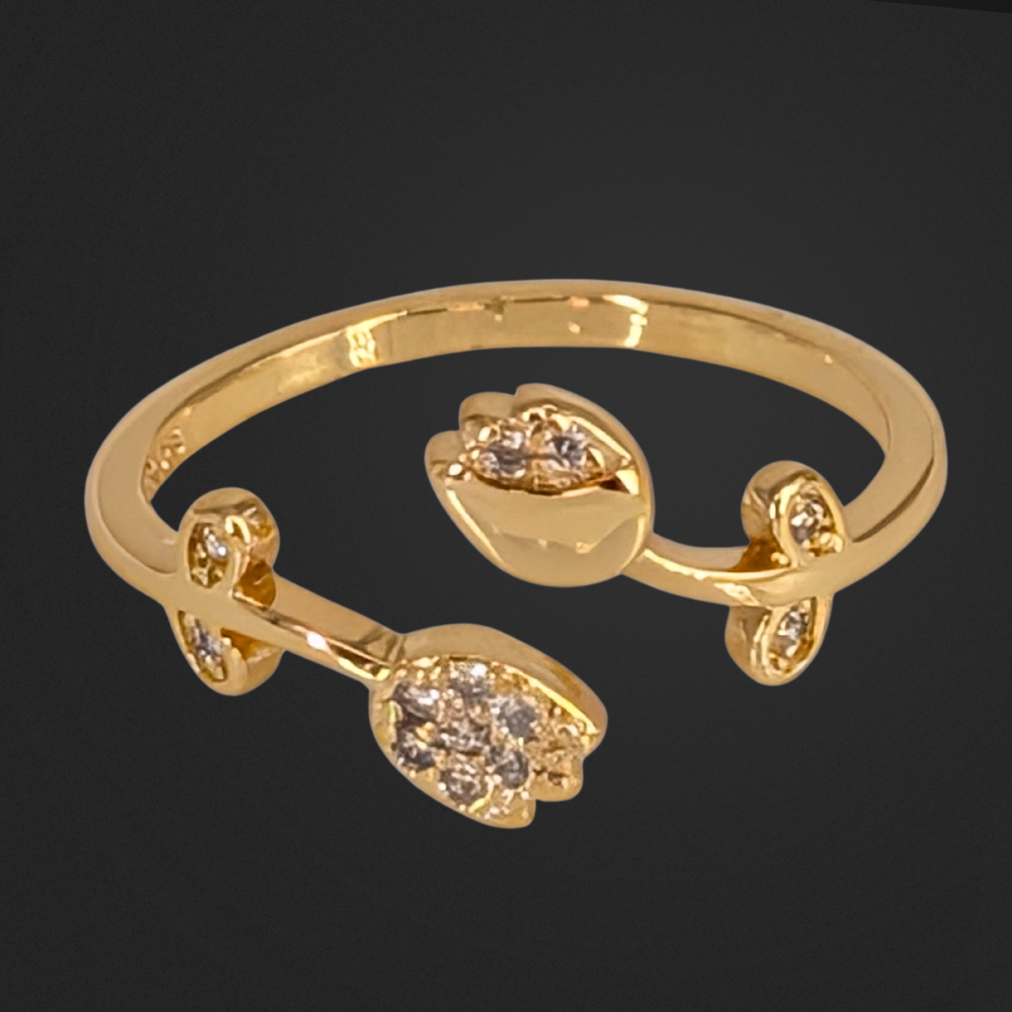 Gold bracelet with tulip-shaped ends on a black background