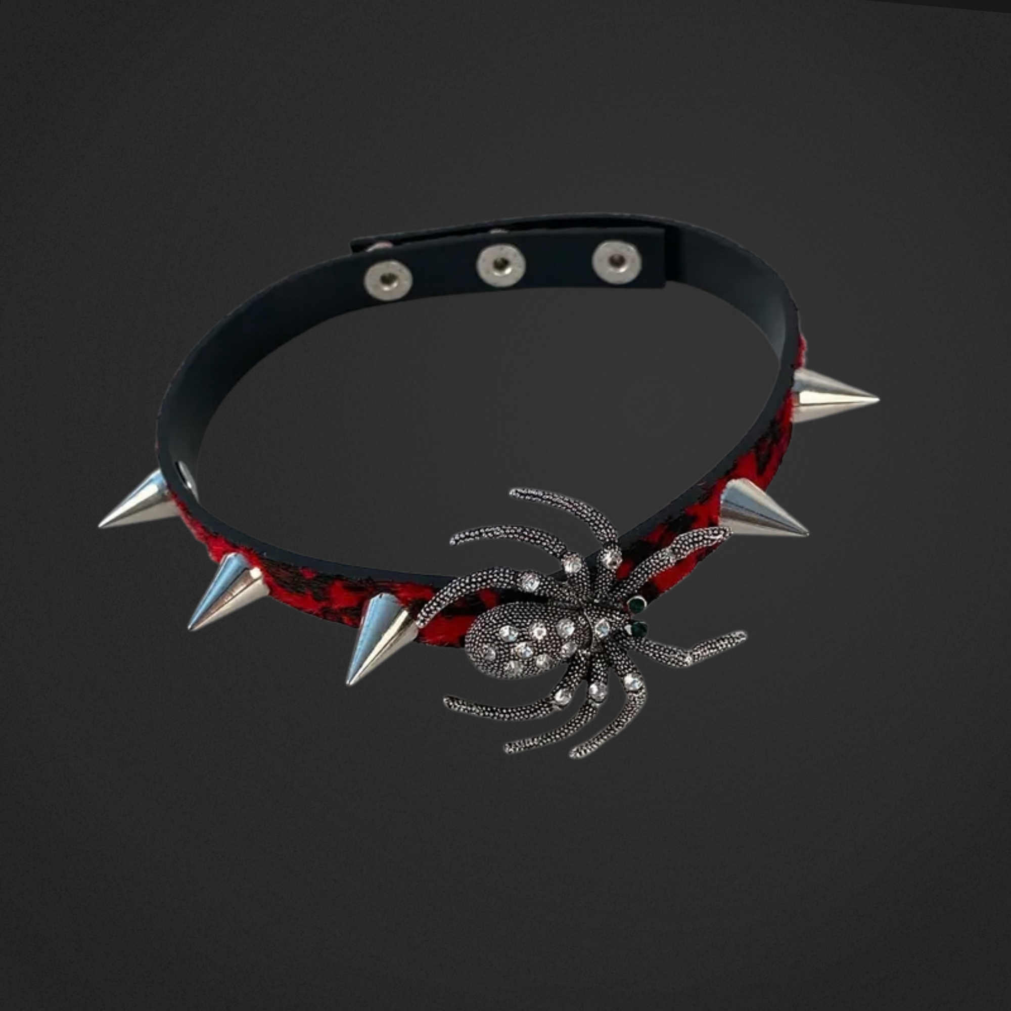 Spiked choker with spider design on a black background