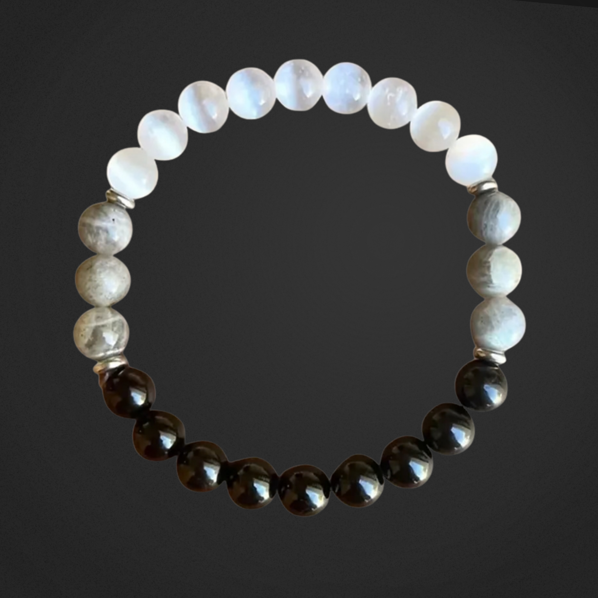 Beaded bracelet with alternating white and dark beads on a black background