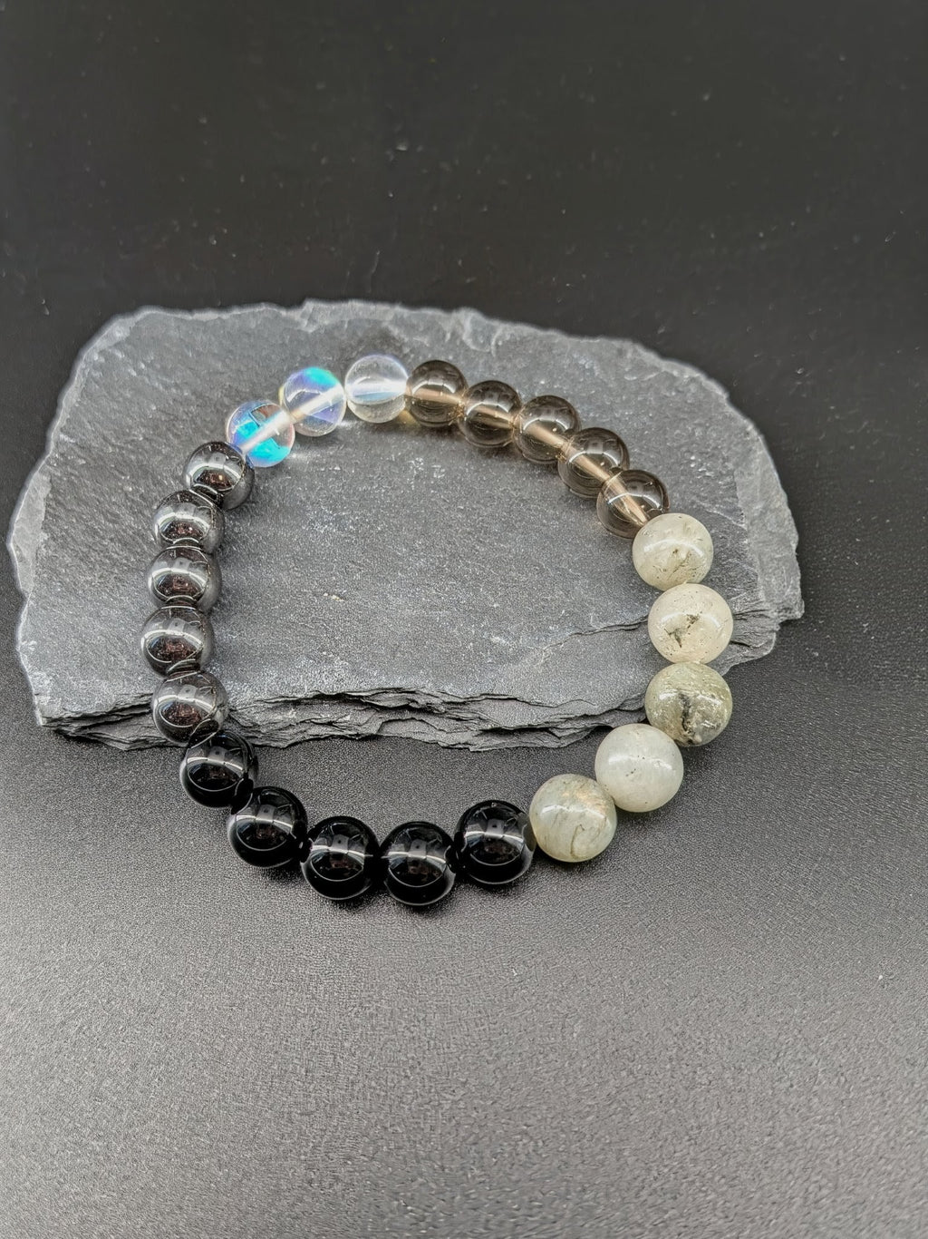 Beaded bracelet on a gray stone surface