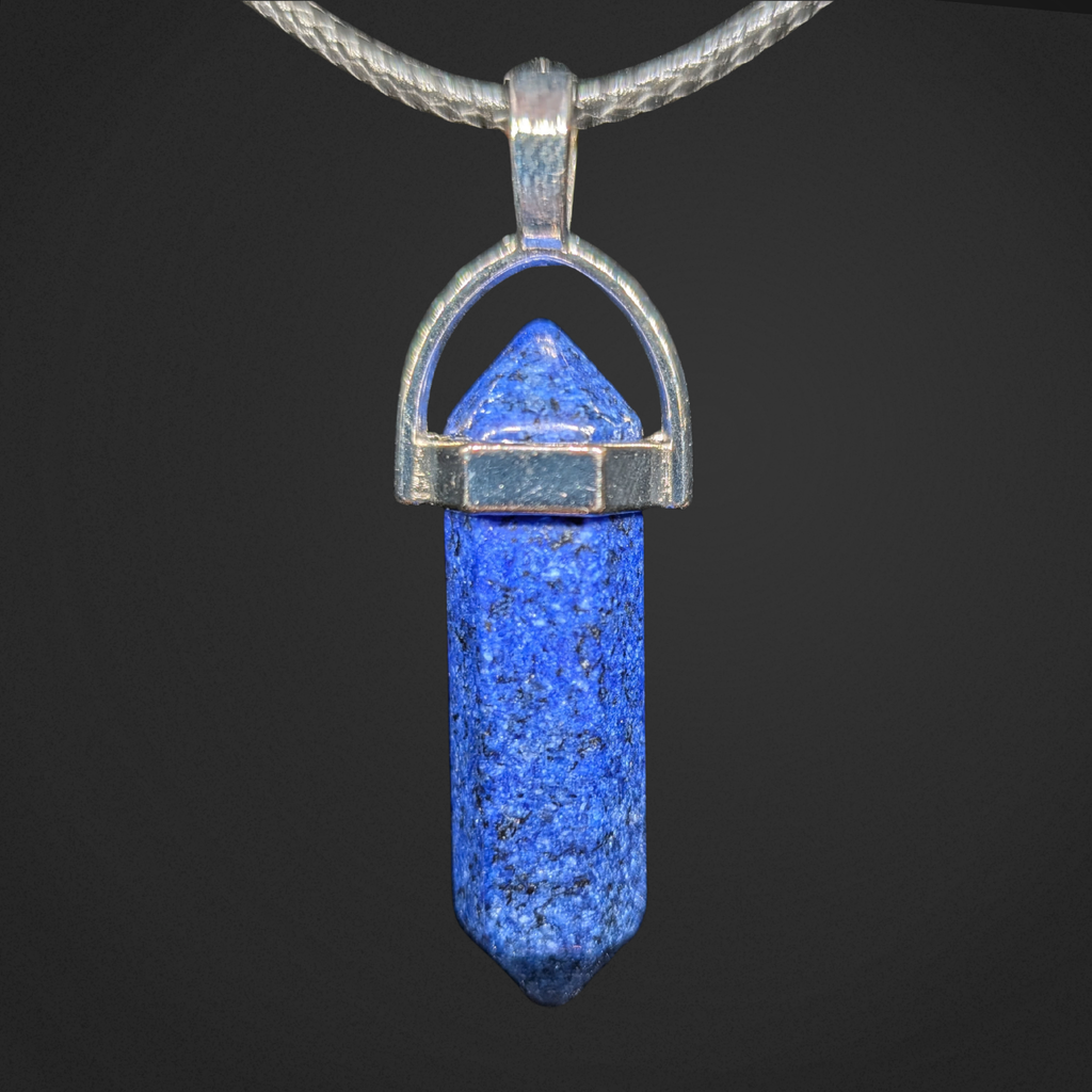 Blue pendant with silver setting on a black background