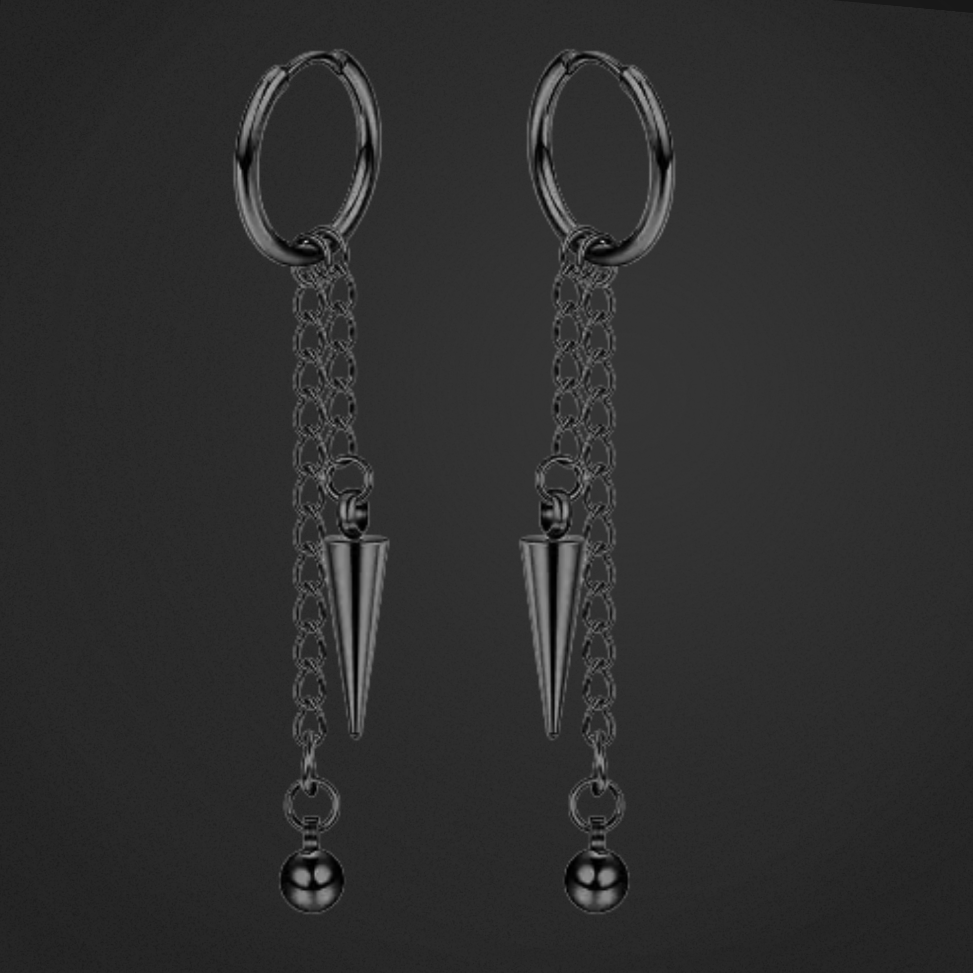 Pair of black hoop earrings with chain and cone-shaped pendant on a dark background