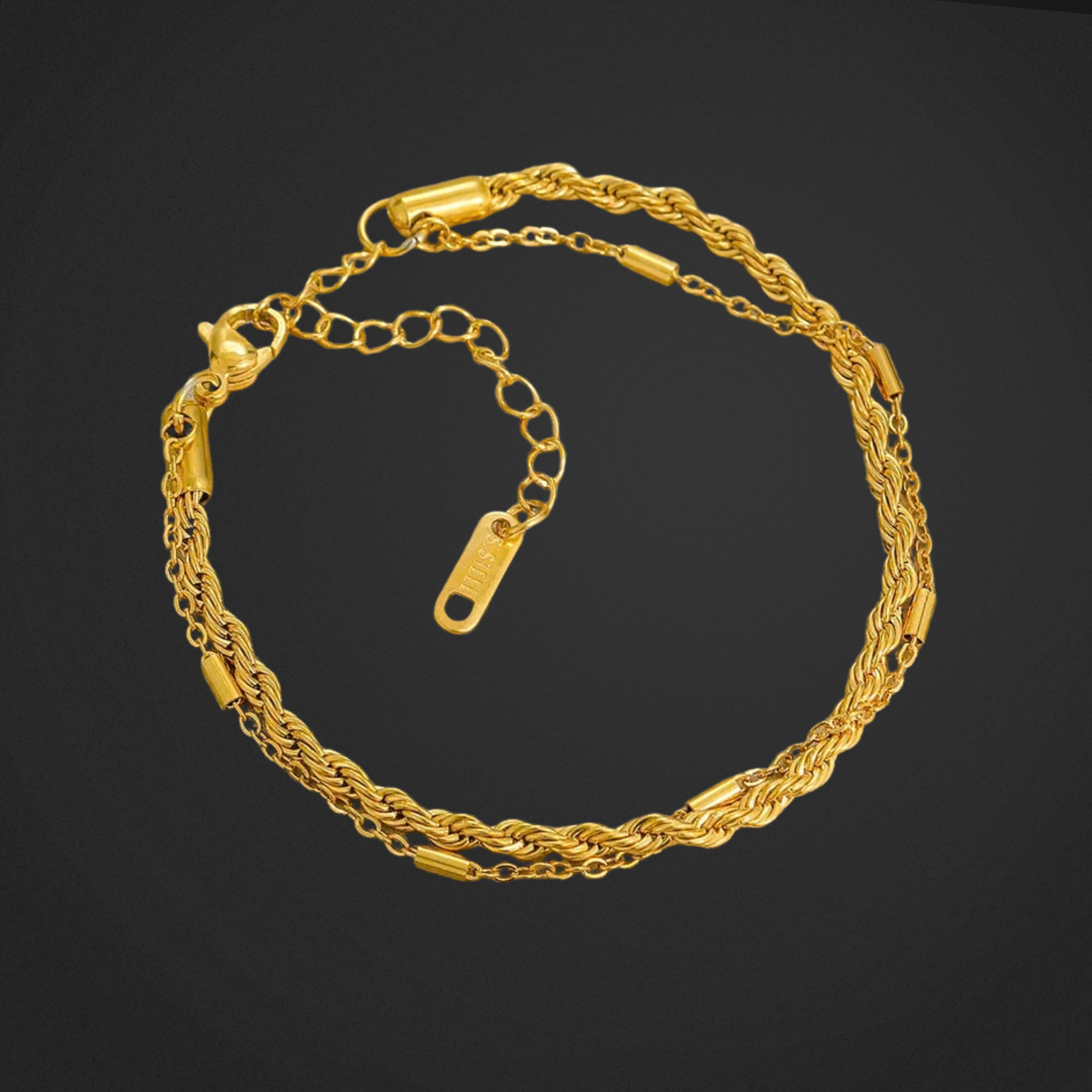 Gold chain bracelet on a black background