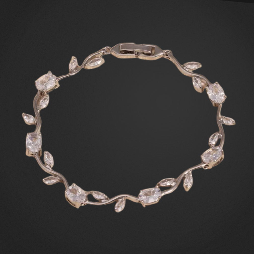 Silver bracelet with diamond-like stones on a black background