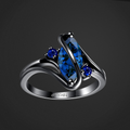 Silver ring with blue gemstones on a black background