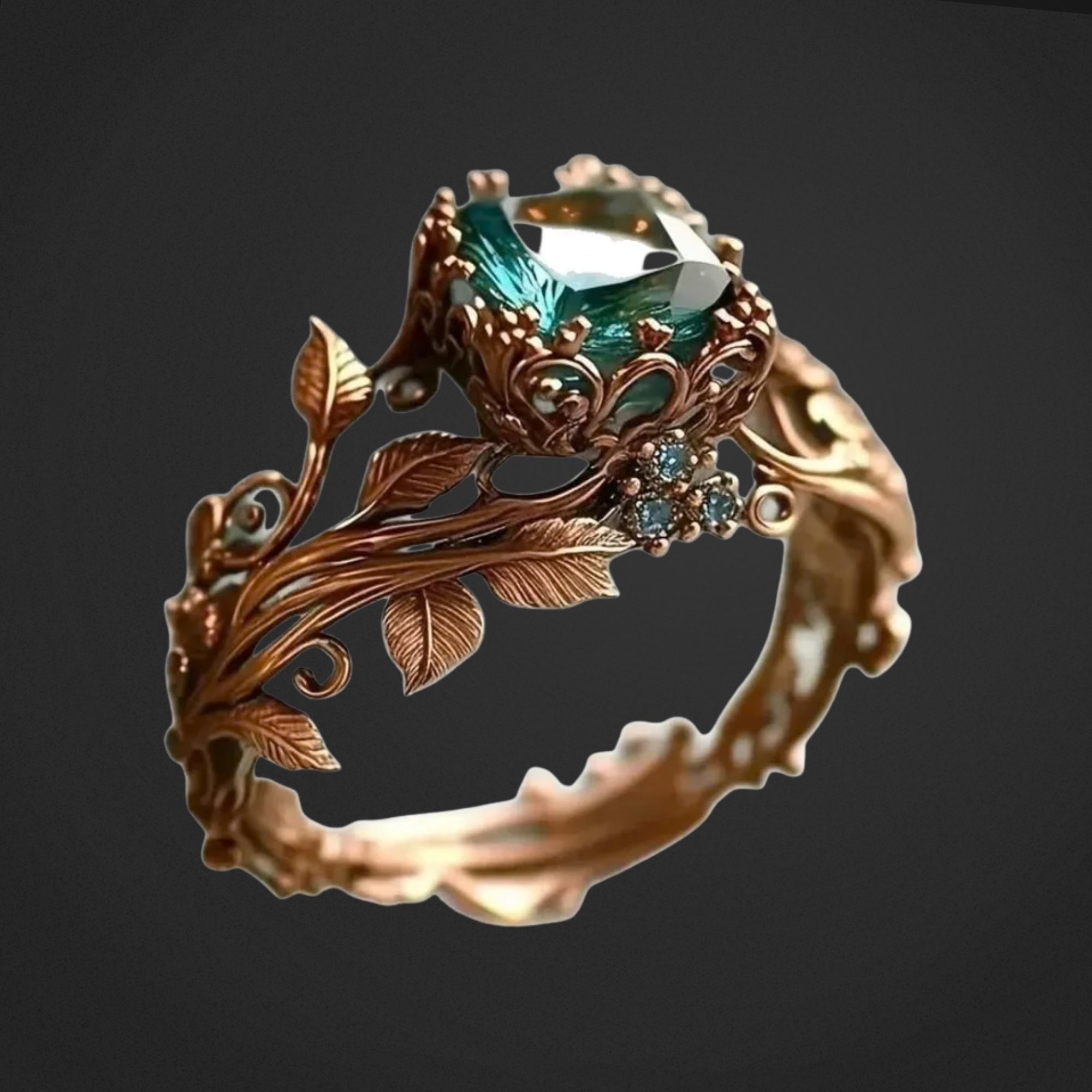 Ornate ring with green gemstone and leaf designs on a dark background