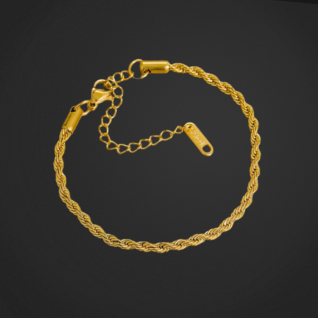 Gold chain bracelet on a black background