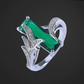 Silver ring with a green gemstone on a black background
