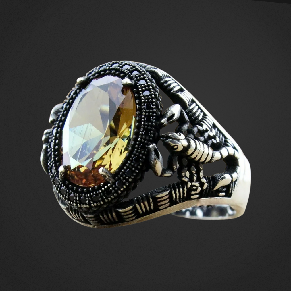 Silver ring with a large gemstone on a dark background