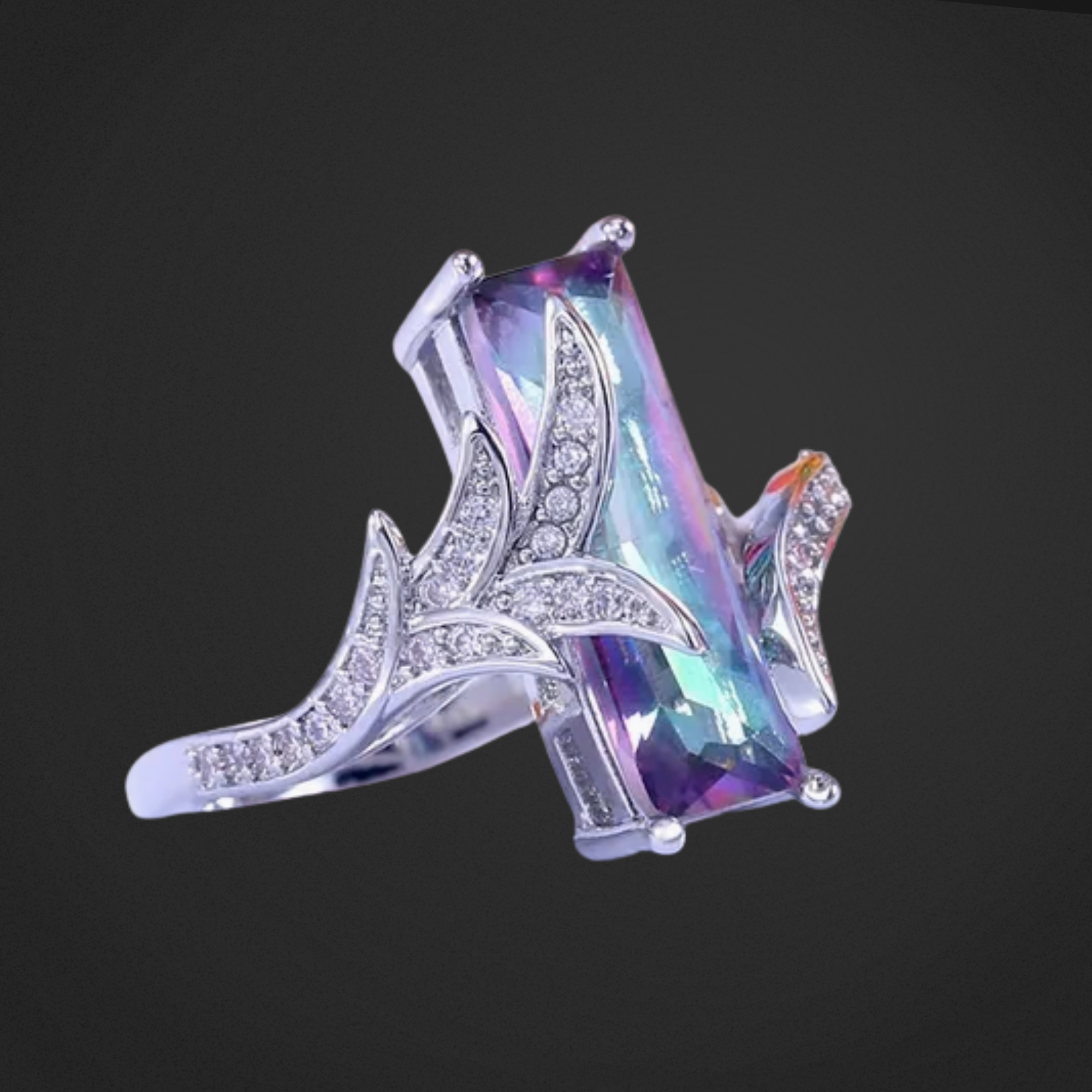 Multicolored gemstone ring with silver band on a black background