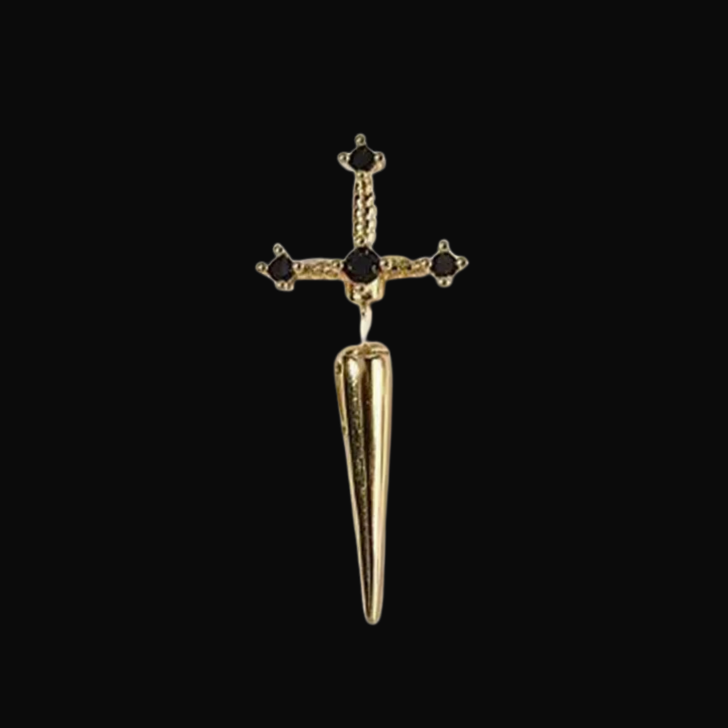 Gold dagger-shaped earring with black gemstones on a black background
